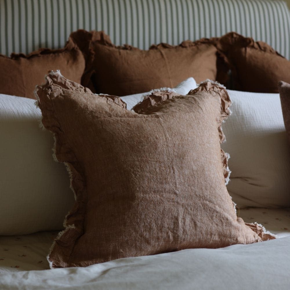 hallie washed rust ruffle cushion