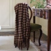 brown and rust tassel throw