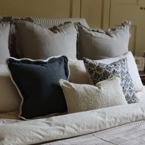 what colour cushions go with a navy sofa?